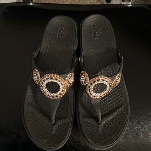 Women black crocs embellished.